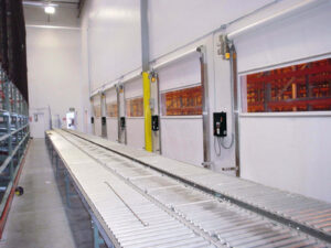 PredaClean fabric doors along a warehouse roller conveyor